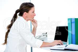 distracted business woman on her laptop