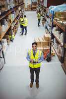 Warehouse worker using hand scanner