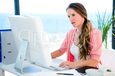 concerned business woman on her computer