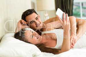 Young couple looking at smartphone