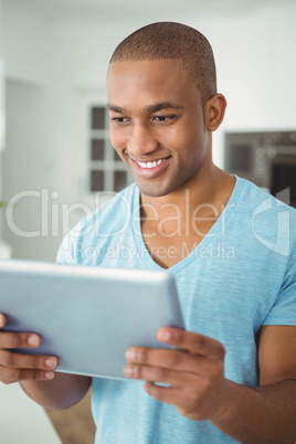 Handsome man using tablet