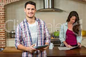 Man using tablet in kitchen