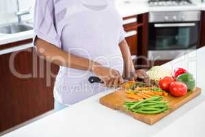 Pregnant woman preparing vegetables