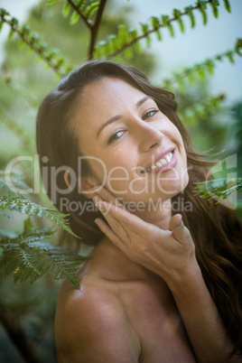 Smiling woman near some trees