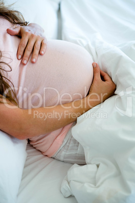 pregnant woman holding her bump