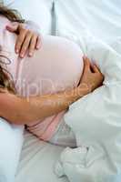 pregnant woman holding her bump