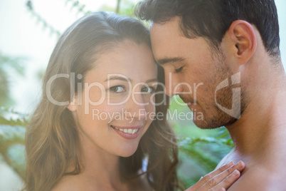 Young couple embracing in garden