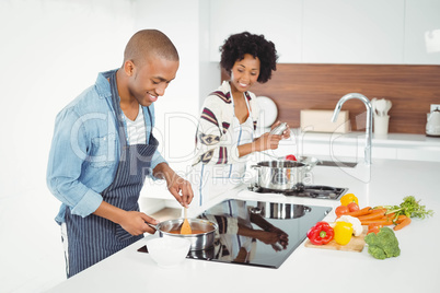 Happy couple cooking together