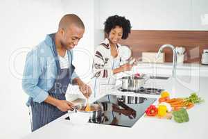 Happy couple cooking together