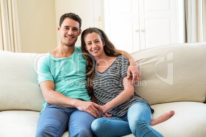 Young couple sitting on sofa