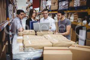 Portrait of smiling warehouse managers