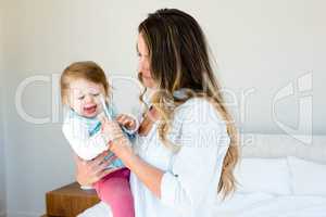 beautiful woman holding an adorable baby