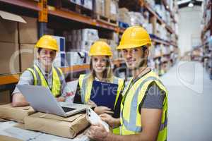 Portrait of smiling warehouse managers