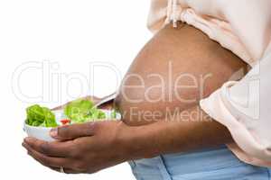 Pregnant woman having a healthy salad