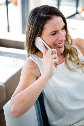 smiling woman making a phone call