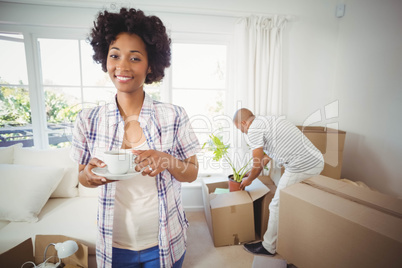 Happy woman holding cup