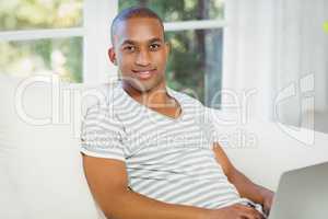 Handsome man using laptop