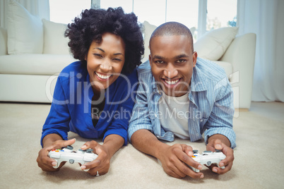 Smiling couple lying on the floor