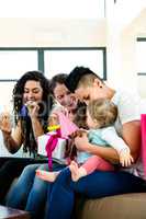 Three women celebrating a babies first birthday