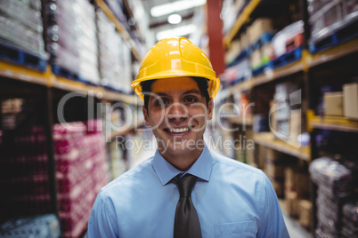 Smiling businesswoman with helmet