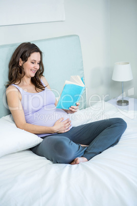 Pregnant woman reading a book