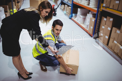 Manager showing clipboard to worker