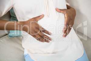 Pregnant woman touching her belly