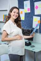 Pregnant woman using tablet