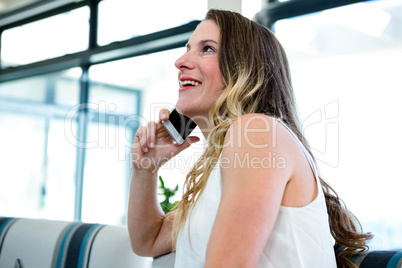 smiling woman making a phone call