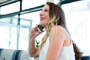 smiling woman making a phone call