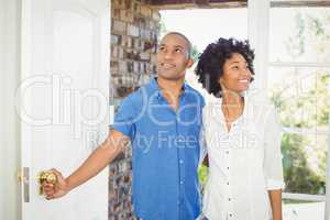 Happy couple about to open the door