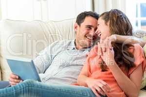 Young couple having fun on sofa