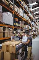 Portrait of smiling warehouse managers