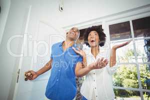 Happy couple entering in their house