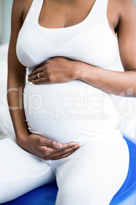 Pregnant woman rubbing her belly