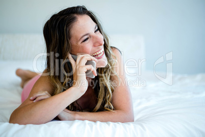 smiling woman making a phone call on her mobile