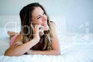 smiling woman making a phone call on her mobile