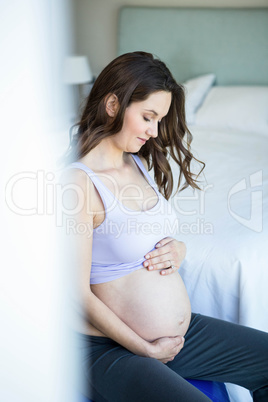 Pregnant woman sitting on exercise ball