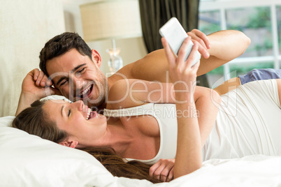 Young couple having fun on bed