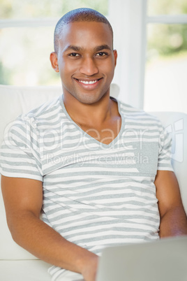 Handsome man using laptop