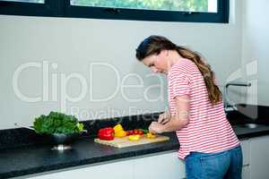 thoughtfull woman preparing vegetables for dinner