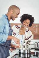 Happy couple cooking together