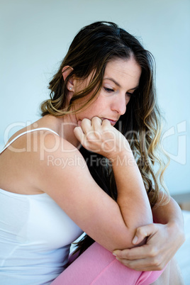 anxious womansitting with her head in her hands