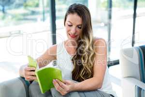 smiling woman  reading a book
