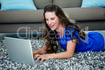 smiling woman on her laptop