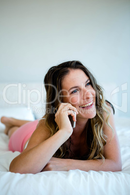 smiling woman making a phone call