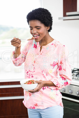 Pregnant woman eating cereal