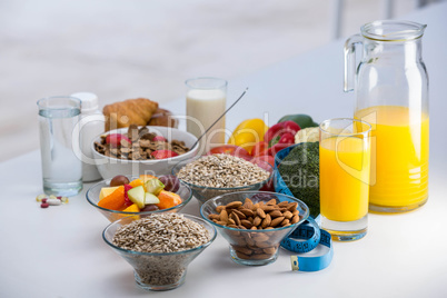 View of bowl of cereals, fruit salad and food