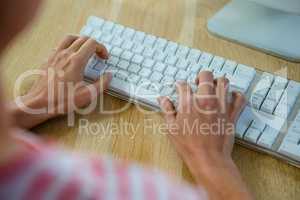 femalehands typing on  a keyboard
