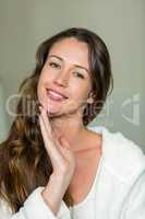 Portrait of beautiful woman touching her chin